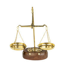 A set of brass scales with a wooden base 