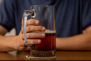 Close-up of Man's Hand Holding a Stein of Beer