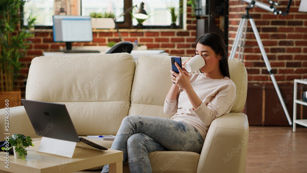 Poster happy woman sending messages on mobile phone while doing work from home and listening to music. joyf