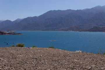 Beautiful scenery with a lake and mountains on a cloudy day.