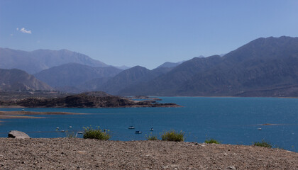 Beautiful scenery with a lake and mountains on a cloudy day.