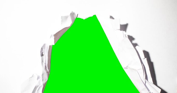 Stop motion of green screen background whit white  papers. Shot in 4k resolution A paper ball spreads making a blank sheet and folds again until it disappears.
