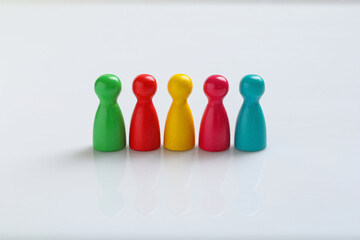 Colorful pawns on white background. Social inclusion concept