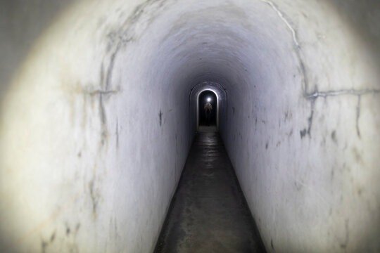 Woman Backpacker Hiker Discovering Tunnels and Bunkers of World War One in Valley of Tolminka in Slovenia