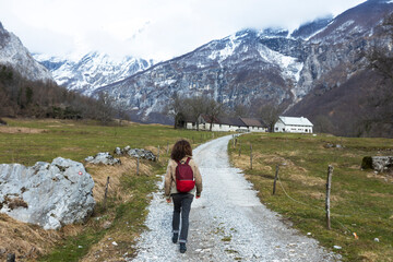 Fototapeta na wymiar Woman Backpacker Hiker Discovering Valley of Tolminka River in Slovenia