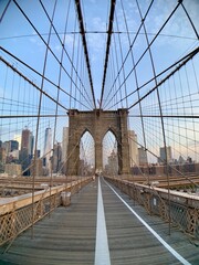 Early Morning In Ny. Low Angle View Of Brooklyn Bridge Againts Sky