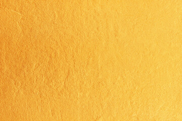 Gold paint on cement wall texture. golden texture background