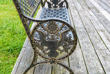 Metal bench with American symbols - American flag, statue of liberty and eagle.