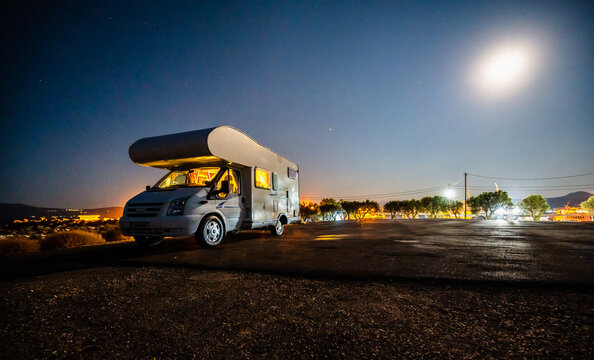 Motorhome Rv Parked Under Stars On A Pier By The Sea, Crete, Greece.