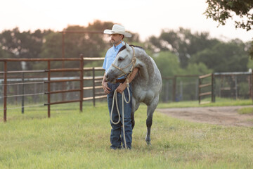 Cowboy horse trainer portrait  with horse