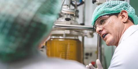 medical scientist with cannabis hemp research in medicine laboratory to make a herbal extract CBD...