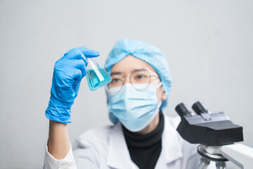 Fototapeta na wymiar blue chemical liquid experiment in scientific glassware equipment in science medicine laboratory, chemistry or biology research discovery by using glass of test tube or beaker and flask