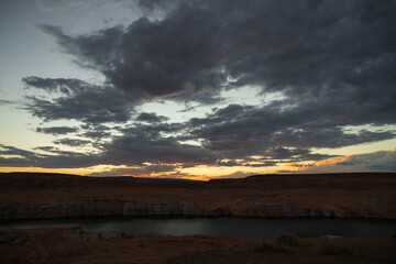 Dark clouds at sunset over Colorado River, Arizona