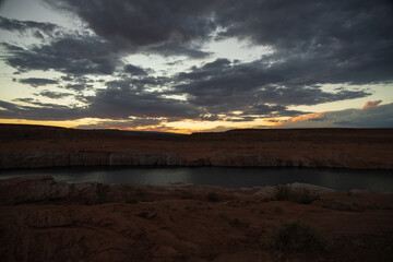 Dark clouds at sunset over Colorado River, Arizona