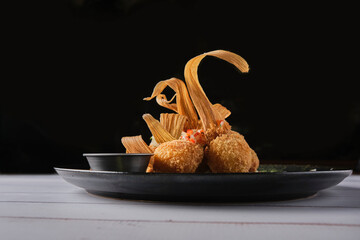 Gourmet corn croquettes, delicious Peruvian corn balls, selective focus