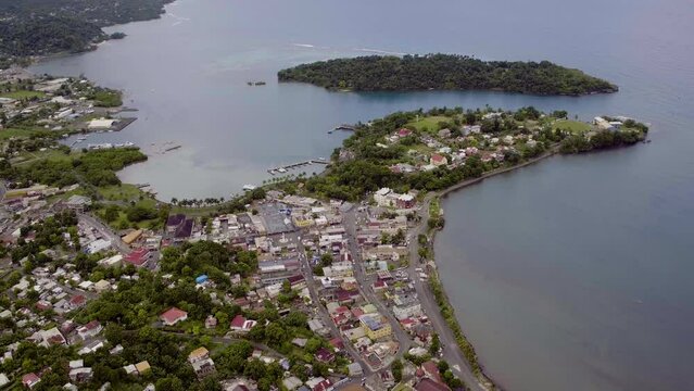 Aerial view from Navy Island to Port Antonio town revealing the west harbour on a calm morning
