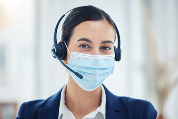 Call center, support or covid help worker with mask for safety and corona protection at work. CRM...