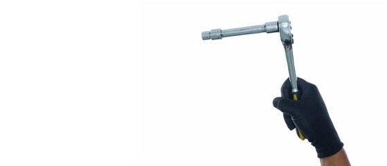 Hand wearing black gloves holding socket ratchet wrench with extension isolated white background with copy space
