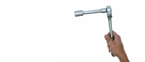 Hand  holding socket ratchet wrench with extension isolated white background with copy space