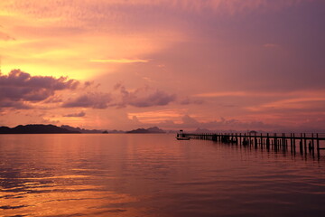 Dramatic sunset and sunrise sky at "Koh Yao Noi" Pier , warm relaxing colours,Phang Nga, thailand