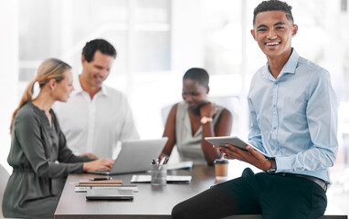 Portrait of a happy businessman smile with a tablet in a team planning meeting at work. An employee in an office with his team as they discuss strategy or plans, and strategies in a corporate office