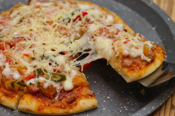 Delicious home made pizza with extra cheese.