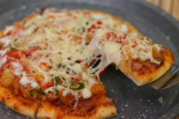 Delicious home made pizza with extra cheese.