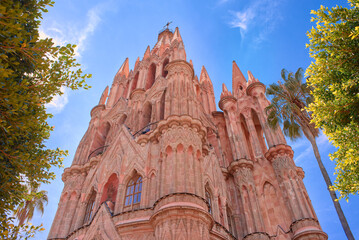 old religious building of san miguel de allende, catholic temple during the day, landmark