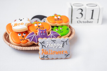 Halloween funny Cookies with 31 October calendar on white background. Trick or Threat, Happy Halloween, Hello October, fall autumn, Festive, party and holiday concept