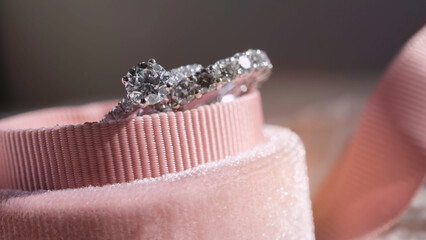 Close up of diamond ring in ring box with sunlight and shadow background. Love, valentine,...