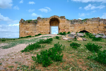 Fototapeta na wymiar Low angle view of ancient ruin gate in Usak, blaundus ancient greek roman city gate.