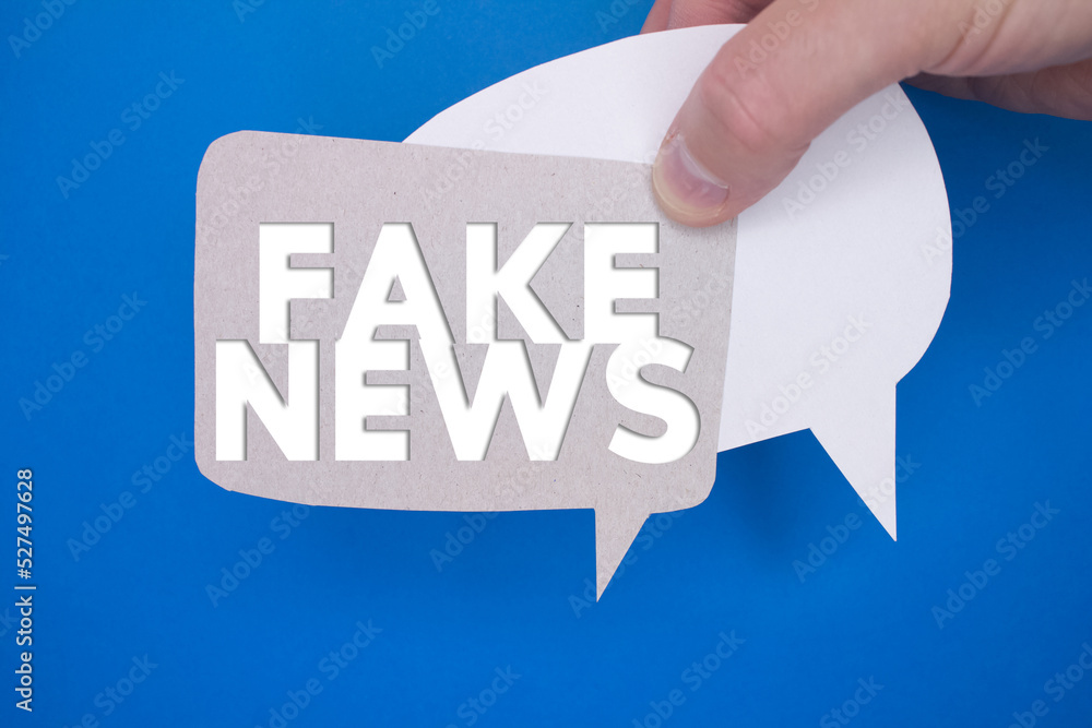 Poster speech bubble in front of colored background with fake news text.