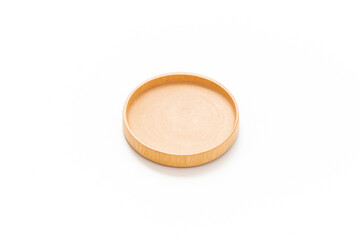 Wooden coaster cup isolated on white background. Round wooden coaster. Product design. Simplicity. Kitchenwear. Tablewear. Home decoration. Household items. Wooden surface.