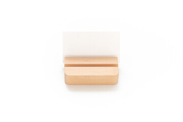 Wooden card holder isolated on white background. Wood surface. Minimalist object. Stationery. Simplicity. Workspace. Equipment.