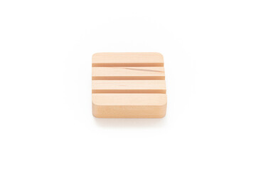 Wooden card holder isolated on white background. Wood surface. Minimalist object. Stationery. Simplicity. Workspace. Equipment.