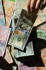 American US  currency and Turkish Lira business concept with dollars bill banknotes