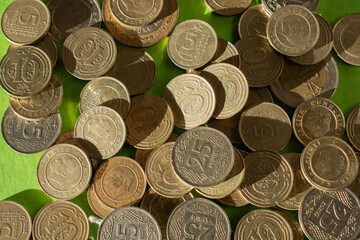 Turkish coins, on green paper background.