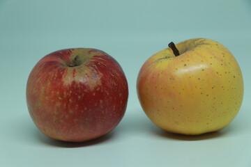 Two fresh red yellow apple isolated on white background.