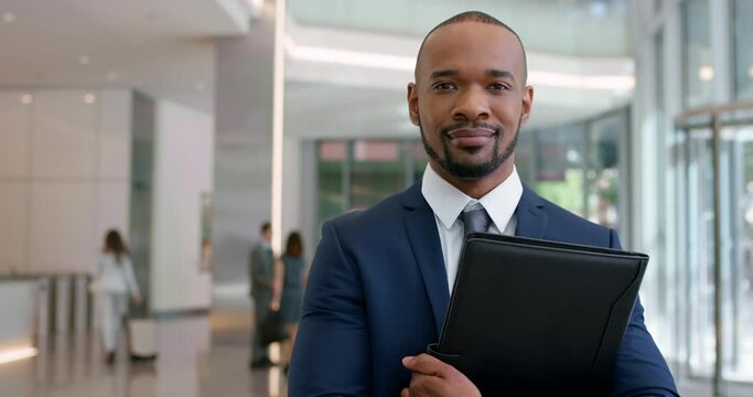 Business man at a conference meeting, working in management at corporate company and professional in suit at work. Portrait of African executive, manager and boss with pride at convention center