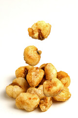 Pile of toasted fried salted corn seeds isolated on white background with clipping path
