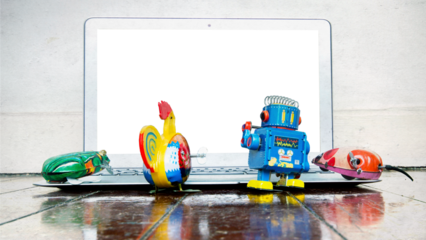 a collection of tin toys watch a laptop  PNG 