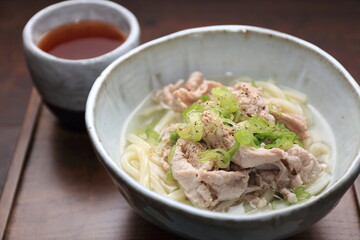 One of the representative foods of Japan, udon noodles and chopsticks on a pottery bowl