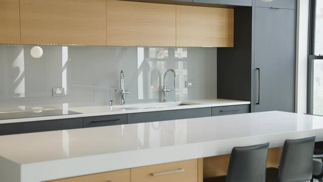 a modern bright luxury kitchen in a downtown loft condo