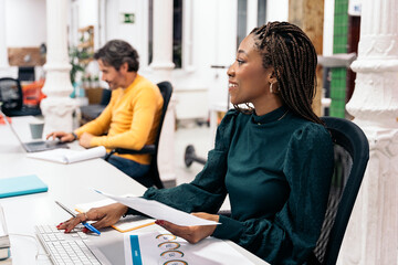 Happy African Woman Working in the Office