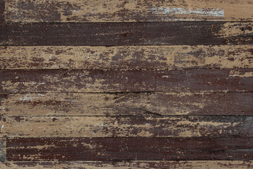 Image of vintage hardwood board with rough surface. Pattern and textured from old plank wooden wall with dark brown scratch coloring background.
