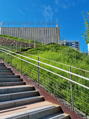 Fototapeta premium Building with lawn and uphill stairs.