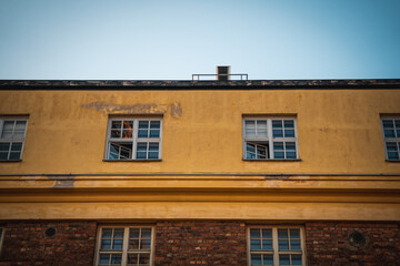 Old worn building exterior with bricks