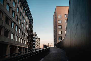 Path with metal rail andbuildings in the background