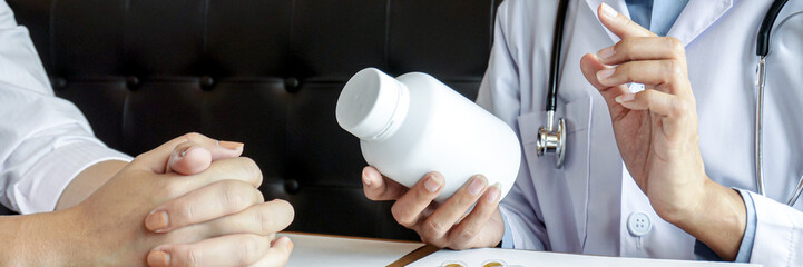 Health care Doctor giving medicine to patient for arthritis pain.