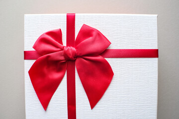 Valentine present. Gift box and red ribbon for romantic couple.Gift box and ribbon with tag for...